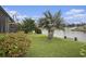 Scenic backyard with lush lawn, mature landscaping, and tranquil waterfront views, perfect for outdoor enjoyment at 388 Sea Turtle Dr., Myrtle Beach, SC 29588