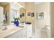 Bright bathroom with a double sink vanity, decorative accents, a large mirror and tiled flooring at 388 Sea Turtle Dr., Myrtle Beach, SC 29588