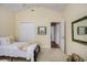 Comfortable bedroom with neutral tones, featuring an open door to an adjacent space and natural light at 388 Sea Turtle Dr., Myrtle Beach, SC 29588