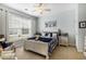 Comfortable bedroom with a large window, ceiling fan, area rug and coordinated decor at 388 Sea Turtle Dr., Myrtle Beach, SC 29588