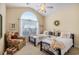 Inviting bedroom featuring a large arched window and two twin beds, creating a cozy and comfortable space at 388 Sea Turtle Dr., Myrtle Beach, SC 29588