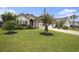 Charming one-story home with well-manicured lawn, palm tree, and a two-car garage at 388 Sea Turtle Dr., Myrtle Beach, SC 29588