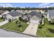 Desirable one-story home featuring a lawn, a palm tree, and an attached two-car garage at 388 Sea Turtle Dr., Myrtle Beach, SC 29588