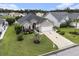 Inviting one-story home featuring a well-kept lawn, palm tree, and a two-car garage at 388 Sea Turtle Dr., Myrtle Beach, SC 29588