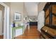 Elegant hallway showcasing hardwood floors, decor, and a glimpse into the living area at 388 Sea Turtle Dr., Myrtle Beach, SC 29588