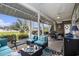 Inviting covered patio with stylish seating, dining area, and serene water views in a comfortable outdoor living space at 388 Sea Turtle Dr., Myrtle Beach, SC 29588