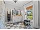 Stylish bathroom with checkerboard floors, double vanity, and natural light, creating a functional and elegant space at 3930 West Marion St., Mullins, SC 29574
