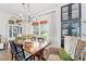 Charming dining room featuring a wooden table, stylish chandelier, and built-in display cabinet at 3930 West Marion St., Mullins, SC 29574