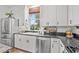 Well-appointed kitchen featuring white cabinetry, granite counters, and stainless steel appliances at 3930 West Marion St., Mullins, SC 29574