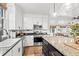 Modern kitchen with granite countertops, stainless steel appliances, and a functional center island at 3930 West Marion St., Mullins, SC 29574