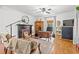Cozy living room with fireplace, hardwood floors, and comfortable seating, great for Gathering gatherings at 3930 West Marion St., Mullins, SC 29574