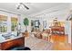Bright living room with hardwood floors, desk area, and cozy seating arrangement, perfect for relaxation at 3930 West Marion St., Mullins, SC 29574