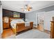 Serene main bedroom features wood accent wall, stylish decor, and hardwood floors, offering a peaceful retreat at 3930 West Marion St., Mullins, SC 29574