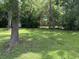 Picturesque backyard offering a serene and private outdoor space with abundant greenery at 404 E Andrews St., Hemingway, SC 29554