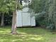 Backyard shed providing extra storage and utility, blending with the natural surroundings at 404 E Andrews St., Hemingway, SC 29554
