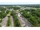 Aerial view of property shows location with surrounding greenery, parking and nearby ocean at 4261 Hibiscus Dr. # 4-104, Little River, SC 29566