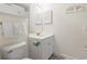 Half bathroom featuring a white vanity, toilet, mirror, and storage, with coastal decor touches for added charm at 4261 Hibiscus Dr. # 4-104, Little River, SC 29566