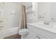 Cozy bathroom with a shower-tub combination, white fixtures, and a vanity with built in storage at 4261 Hibiscus Dr. # 4-104, Little River, SC 29566