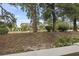Exterior view of townhomes featuring covered front porches, dormer windows, and mature trees at 4261 Hibiscus Dr. # 4-104, Little River, SC 29566
