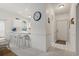 Bright, modern kitchen with white cabinets, bar seating, and a view of the front door at 4261 Hibiscus Dr. # 4-104, Little River, SC 29566