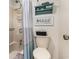 Bathroom with a shower and tub, a toilet, and decorative shelving above the toilet at 4290 Pinehurst Circle # B3, Little River, SC 29566