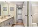 Hall bathroom featuring a vanity and sink, with a laundry closet accessible nearby at 4290 Pinehurst Circle # B3, Little River, SC 29566