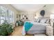 Bright bedroom with natural light, a decorative wreath, and light wood flooring at 4290 Pinehurst Circle # B3, Little River, SC 29566