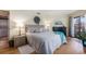 Cozy bedroom with calming colors, gray bedding, and a laundry room nearby at 4290 Pinehurst Circle # B3, Little River, SC 29566