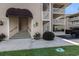 Inviting condo entrance with covered awning and manicured landscaping at 4290 Pinehurst Circle # B3, Little River, SC 29566