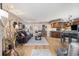 Open-concept living room with wood floors and adjacent kitchen at 4290 Pinehurst Circle # B3, Little River, SC 29566