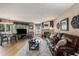 Living room with fireplace, tv and adjacent dining and kitchen areas at 4290 Pinehurst Circle # B3, Little River, SC 29566