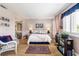 Cozy main bedroom featuring a queen bed, sitting area, and ensuite bath access at 4290 Pinehurst Circle # B3, Little River, SC 29566