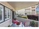 Outdoor patio with seating, foliage and a view of the building exterior at 4290 Pinehurst Circle # B3, Little River, SC 29566