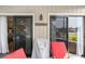 Covered porch with grill and seating area, perfect for enjoying the outdoors and neighborhood views at 4290 Pinehurst Circle # B3, Little River, SC 29566