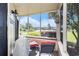 Enclosed porch featuring outdoor seating with a view of the pond at 4290 Pinehurst Circle # B3, Little River, SC 29566