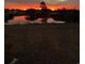 Beautiful sunset reflecting on a tranquil pond creating a serene atmosphere at 4290 Pinehurst Circle # B3, Little River, SC 29566