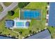 Aerial view of community pool and tennis courts with well-manicured landscaping at 4520 Lighthouse Dr. # 29B, Little River, SC 29566