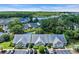 Stunning aerial view of townhomes nestled along a scenic river with lush greenery and water views at 4520 Lighthouse Dr. # 29B, Little River, SC 29566
