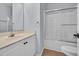 Clean bathroom features a vanity with a sink and a shower-tub combo with glass doors at 4520 Lighthouse Dr. # 29B, Little River, SC 29566