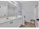 Bathroom with a dual sink vanity, a framed mirror, and a walk in shower at 4520 Lighthouse Dr. # 29B, Little River, SC 29566