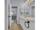 Bathroom with a dual sink vanity and a view into the main bedroom at 4520 Lighthouse Dr. # 29B, Little River, SC 29566