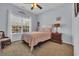 Cozy bedroom with large window, ceiling fan, rocking chair and neutral carpet at 4520 Lighthouse Dr. # 29B, Little River, SC 29566