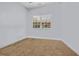 Empty bedroom with neutral carpeting and a window looking out to the neighborhood at 4520 Lighthouse Dr. # 29B, Little River, SC 29566