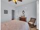 Comfortable bedroom featuring a ceiling fan, wooden furniture and rocking chair at 4520 Lighthouse Dr. # 29B, Little River, SC 29566