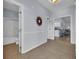 Inviting hallway with tile floors leads to a well-lit bathroom, kitchen, and open living space at 4520 Lighthouse Dr. # 29B, Little River, SC 29566