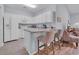 Functional kitchen with white cabinets and breakfast bar with counter seating at 4520 Lighthouse Dr. # 29B, Little River, SC 29566