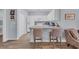 Well-lit kitchen boasts white cabinets, modern appliances, and breakfast bar with seating at 4520 Lighthouse Dr. # 29B, Little River, SC 29566