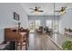 Bright living room with desk, ceiling fan, and french doors leading to the outside at 4520 Lighthouse Dr. # 29B, Little River, SC 29566