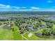 Aerial view of a residential area with golf course, ponds, and water views at 4532 Spyglass Dr., Little River, SC 29566