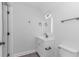 Modern bathroom with white vanity, stylish black faucet, and clean design, offering a fresh and contemporary feel at 4532 Spyglass Dr., Little River, SC 29566
